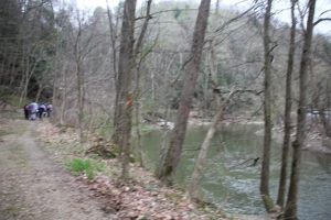 Following the bank of the creek.